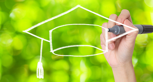 Bachelor hat drawing with green bokeh background