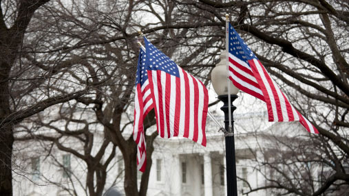 The White House, Washington DC with two flags in front